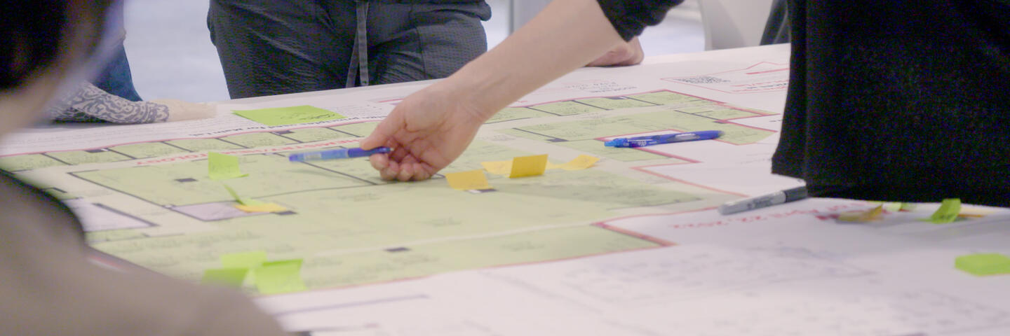 Staff reviewing floorplans