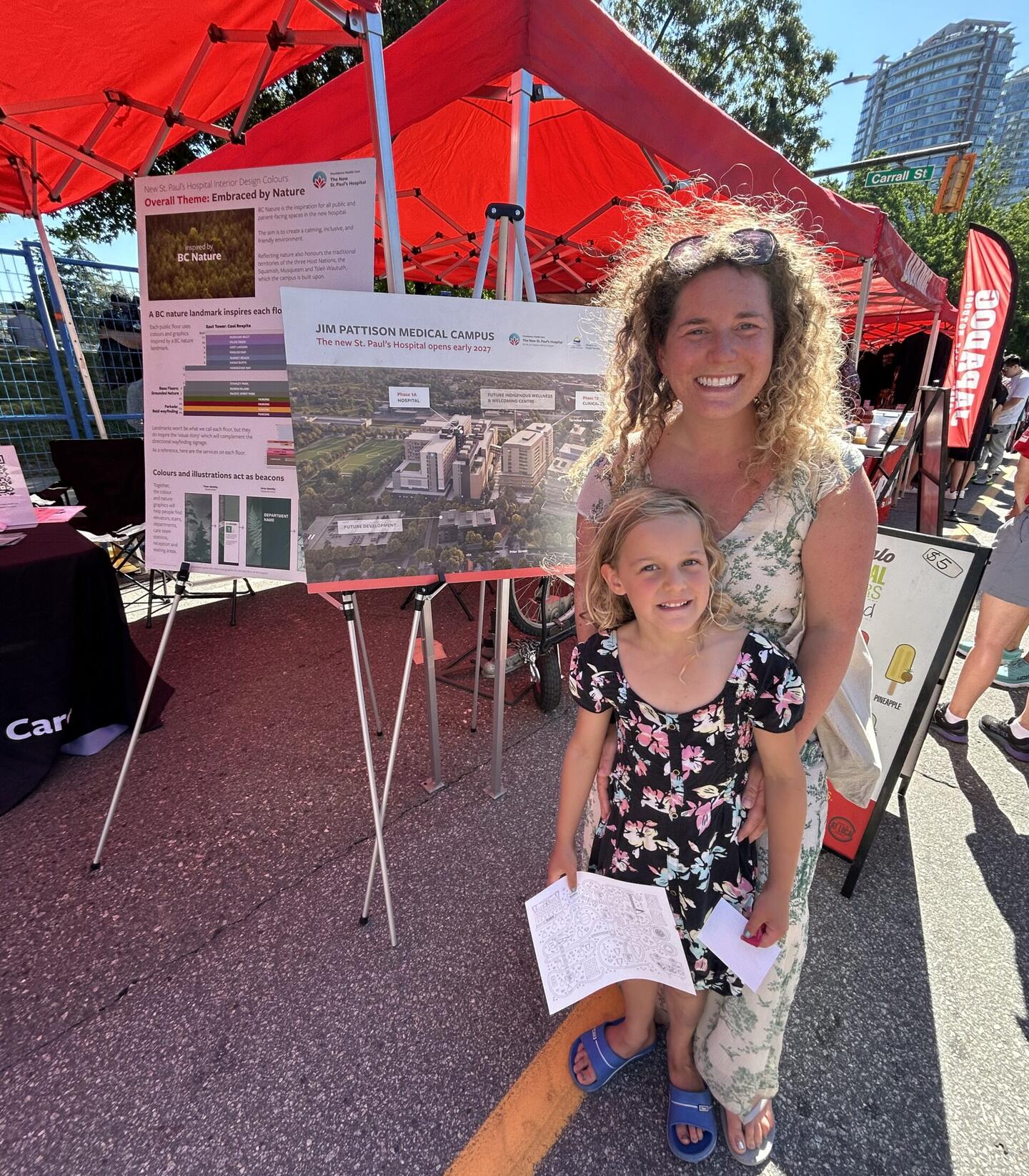 Six-year-old Sonoma and mom Lisa visit the Providence booth at the Vancouver Chinatown Festival (July 13, 2024).